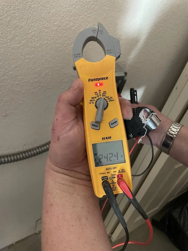 Voltage testing with clamp meter during Outlet Installation in Neptune City